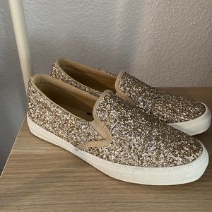 Size 6 slip on gold glitter shoes.
